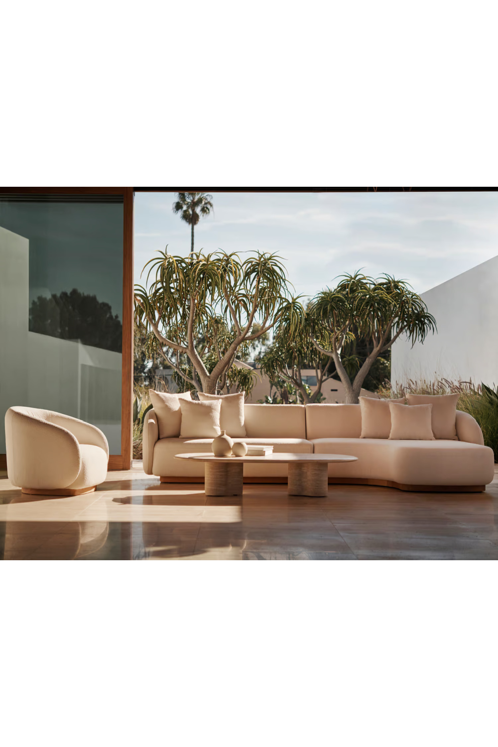 Oval Travertine Outdoor Coffee Table | Andrew Martin Porto | Oroa.com